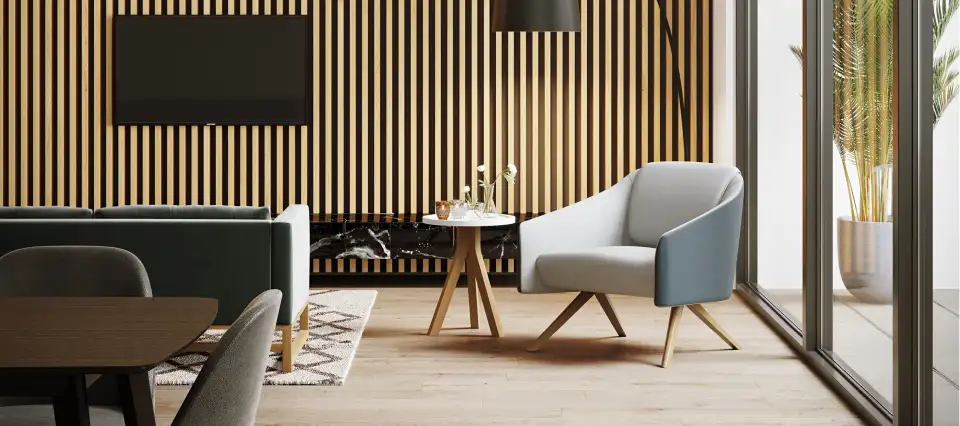 Office lounge area with a timber-slatted wall, armchairs and a TV