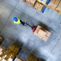 Aerial view of a warehouse with a pallet truck and boxes