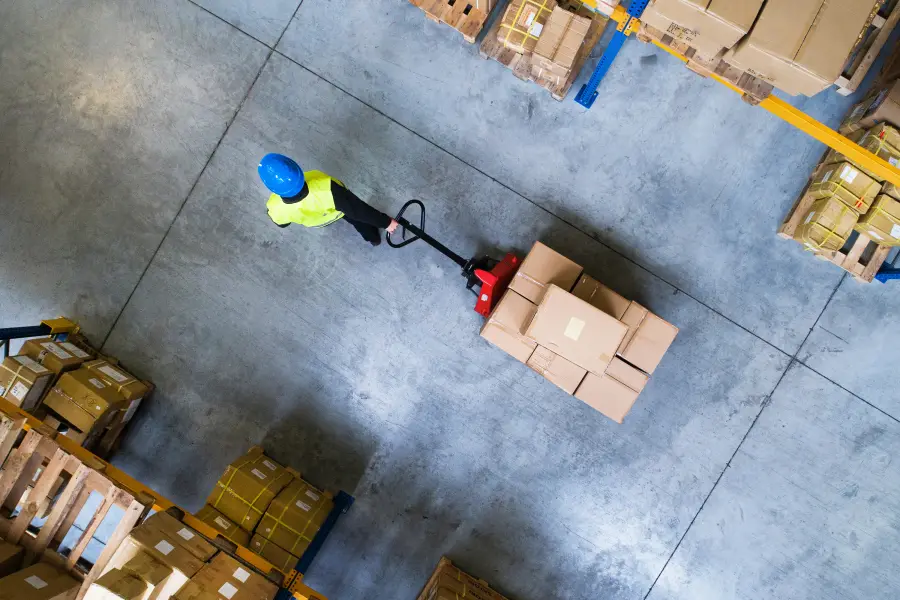 Aerial view of a warehouse with a pallet truck and boxes