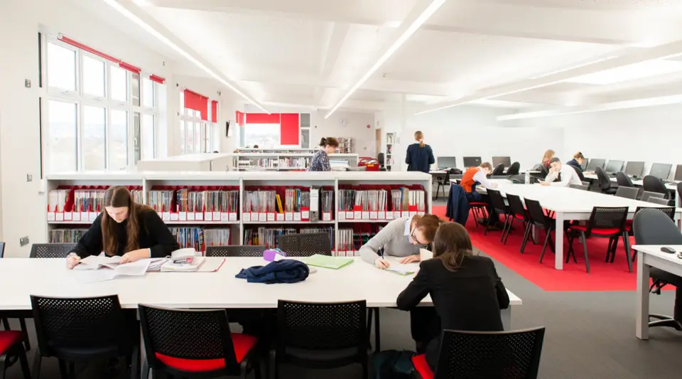 Students at study tables in the Pate&rsquo;s Grammar School library