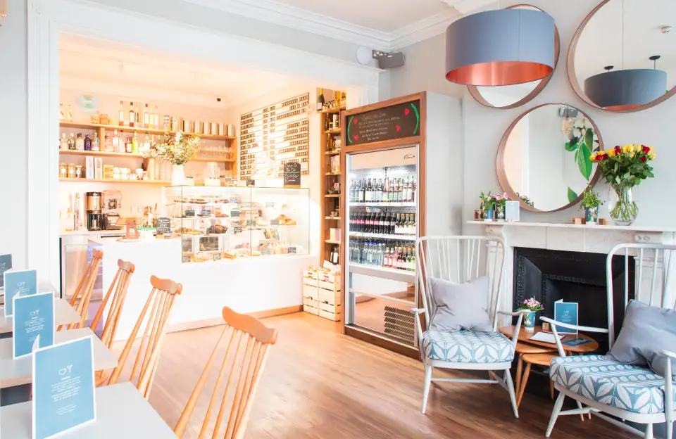 The Find café counter with pendant lights and seating