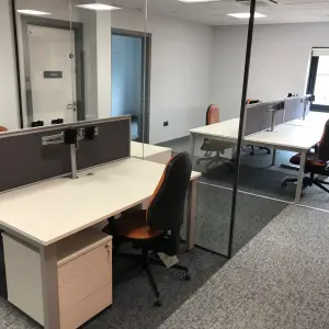 Staff office with desks and screens at The Wilson Health Centre