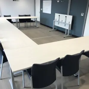 Meeting room with a long table and chairs at The Wilson Health Centre
