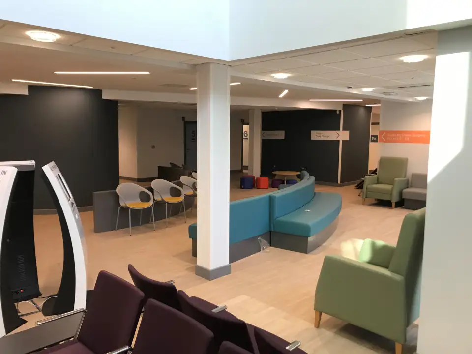 Waiting area with teal, green and purple seating at The Wilson Health Centre